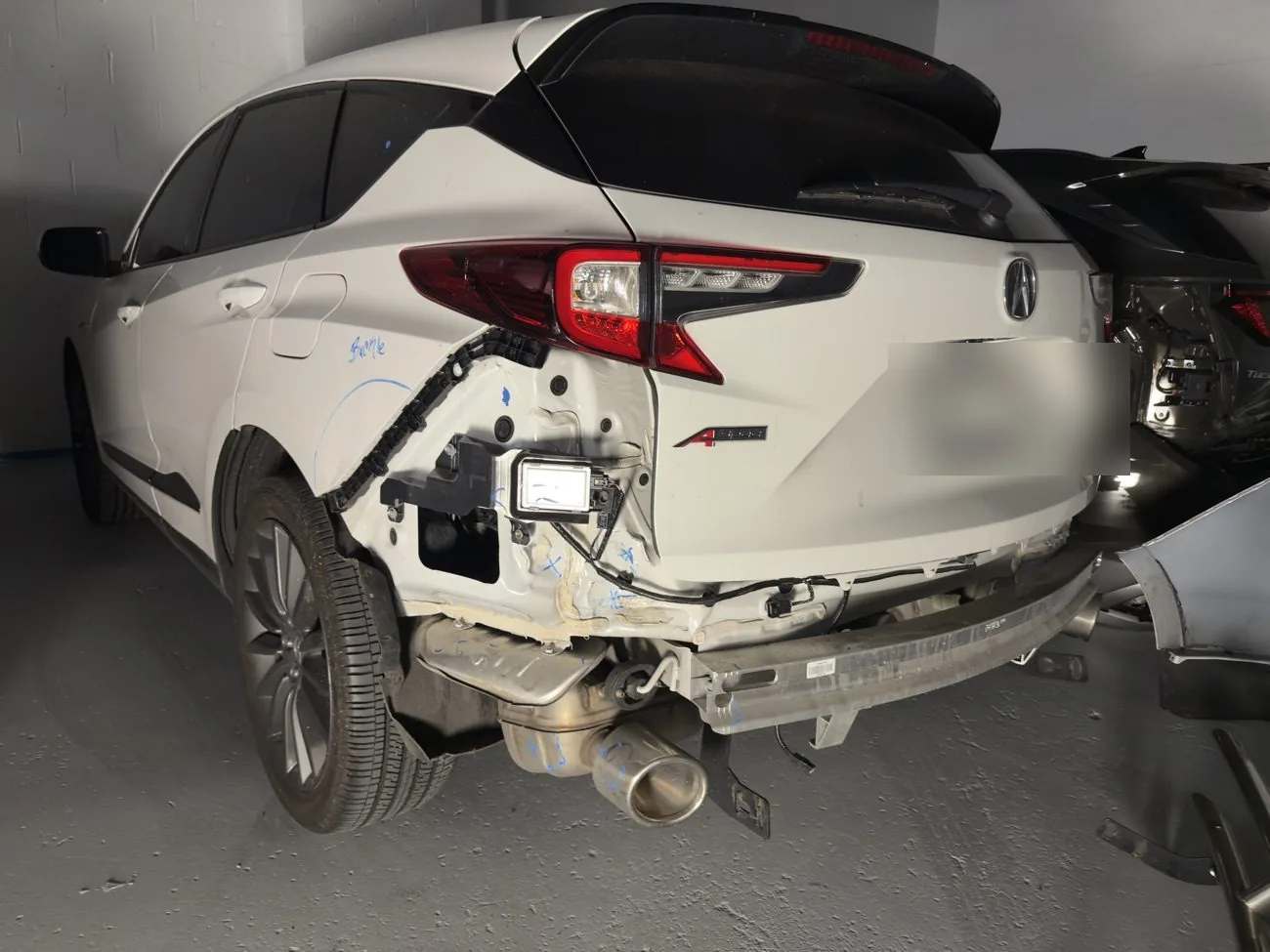 Acura RDX with rear bumper collision damage before auto body repair at Exclusive Collision & Repair in Brooklyn, NY